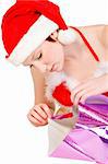 Beautiful girl dressed in a christmas lingerie set unwrapping a gift box With clipping path for your convenience