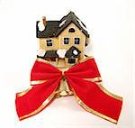 Winter toy-house with red bow