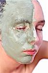 Nude woman model with a partial clay mask