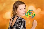 fashion girl with a rainbow lollipop