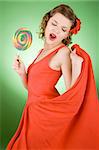 girl in red with a rainbow lollipop