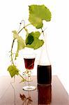 red wine glass and bottle isolated on white