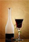 red wine glass and bottle