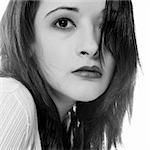 Studio portrait of pretty brunette looking up