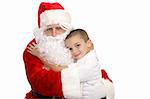 Adorable little boy giving Santa Claus a hug.  Isolated on white.