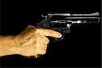 Cropped shot of a female hand holding a .38 calibre revolver