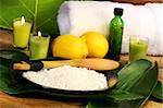 Sea salt, lemons and leaves with towel for spa session