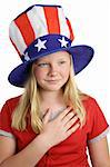 A pretty young girl saying the pledge of allegiance on the fourth of july.  White background.