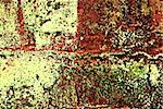 Deteriorating painted brick wall stylized with grunge effects (part of a photo illustration series)