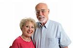 An attractive senior couple against a white background. Horizontal view.