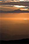 View over layered mountains on a beautiful Sunset.