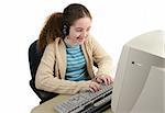 A teen girl smiling as she surfs the internet.