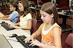 School children learning computers in the library media center.