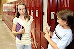 A humorous photo of a school girl reacting to a boy who is trying to flirt with her.