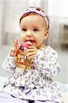 Cute baby is drinking tea