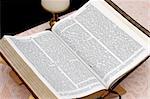 a Bible open to John.  Focus is on text near top center of book. Clipping path included