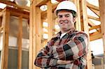 A handsome, friendly construction worker on the job site.  Authentic construction worker on actual construction site.