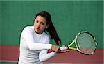 Teenage girl playing tennis