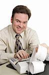 A friendly smiling accountant working on his adding machine.  Isolated on white.