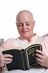 A medical patient reading the bible for inspiration.