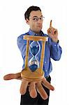 Businessman with hourglass aware of the approaching deadline - isolated - focus on hourglass