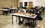 An adult education class sound asleep on their desks.