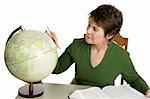 A student or librarian doing research with an encyclopedia and globe.  Isolated on white.  Note to inspector: texture of knit shirt may appear as artifacting.