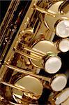 Macro image of the valves and keys of a saxophone.