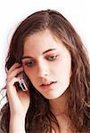 Portrait of a pretty brunette girl talking on cellphone