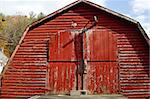 Red barn with double doors.