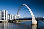 The supporting arch of the Clyde Arc bridge in Glasgow, Scotland, against a blue sky