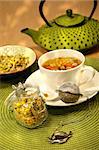 Closeup of chamomile  tea with asian teapot