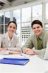 Businessman and businesswoman meeting in office