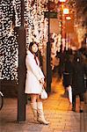 Japanese Women Leaning Against Pole In Street