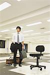 Businessman Standing At Deserted Office