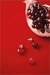 Close Up Of Pomegranate Seeds On Red Background