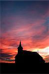 Church on the prairie landscape during sunset