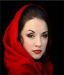 Young woman in a red scarf on black