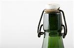 antic top of a green bottle with cap