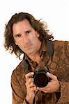 Man with long hair holding DSLR photo camera
