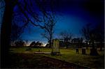 A spooky graveyard at sundown