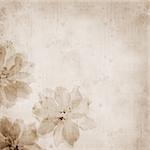 old paper background with delphinium flowers "printed" in the corner