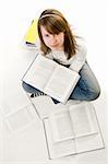 Portrait of Happy young schoolgirl reading books