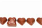 A line of delicious heart shaped milk chocolates.