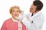 Cosmetic surgeon injecting a senior woman's face to fill in wrinkles.  Isolated on white.