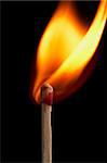 close up macro of a match on fire