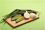 vegetables on the board over gteen background