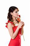 beautiful young woman in a red dress holding a rose bud for her valentine