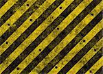 old grungy yellow hazard stripes on black road full of bulletholes