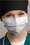 Close up of smiling female medical staff wearing surgical mask